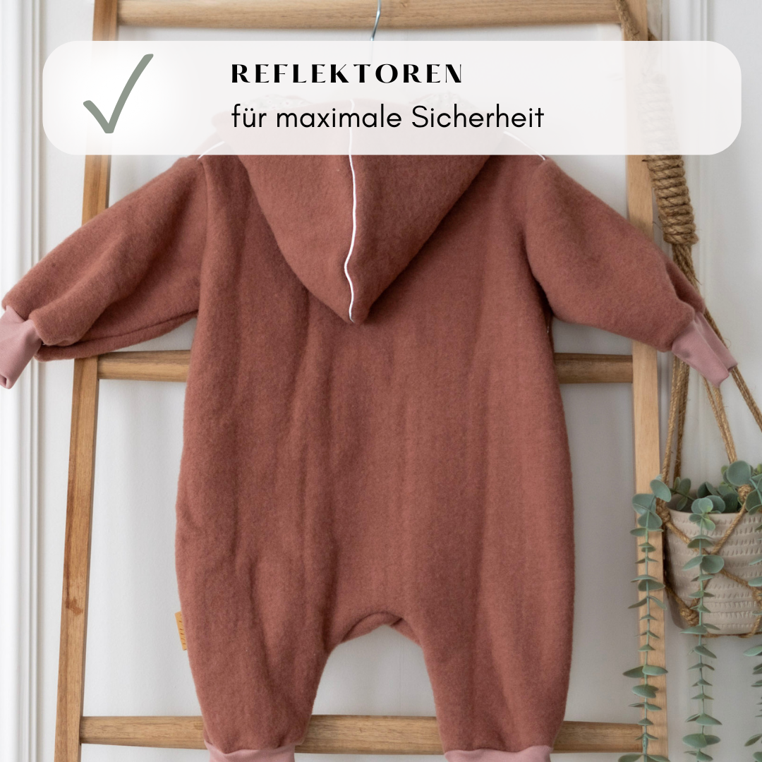 Reflektierende Details am Wollfleece-Overall – für mehr Sicherheit und Sichtbarkeit in der Dämmerung