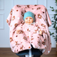 Kind im Kindersitz-Poncho aus Fleece – sicher & warm unterwegs -rosa mit Löwen