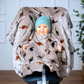 Kind im Kindersitz-Poncho aus Fleece – sicher & warm unterwegs - beige mit Dinos